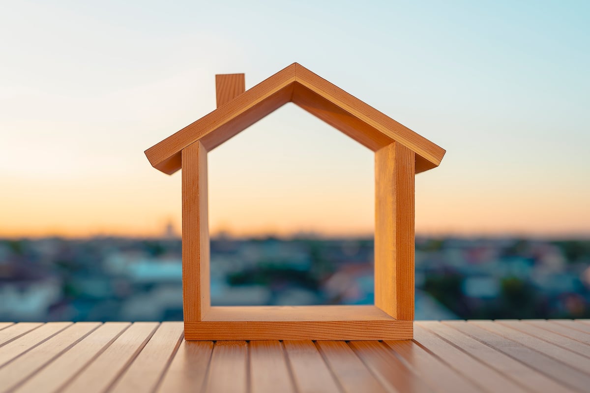 A model home symbolizing the dream of secure, stable affordable living